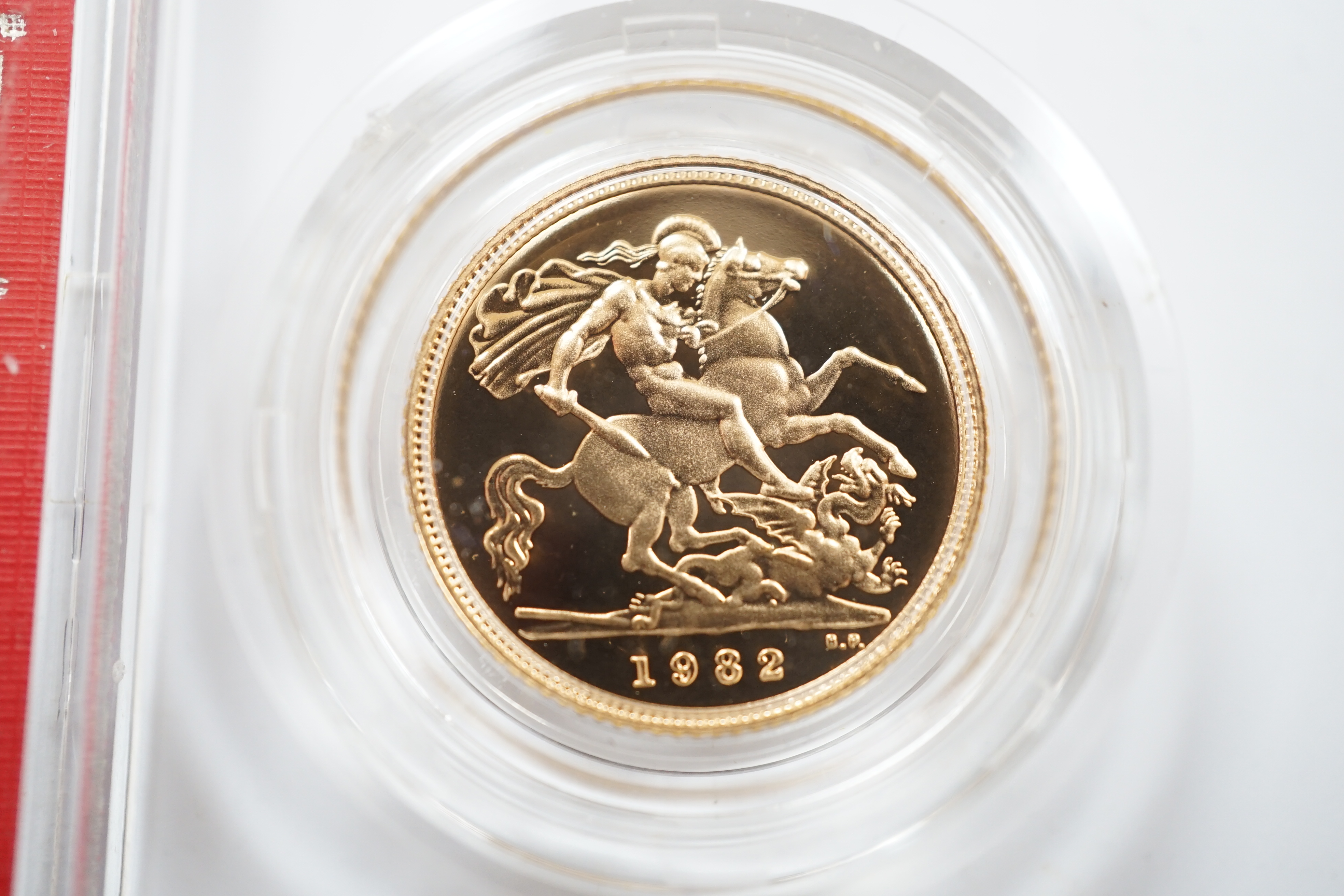 British gold coins, Elizabeth II, 1980 gold sovereign in case of issue, BUNC and a 1982 gold proof half sovereign, in case of issue with certificate